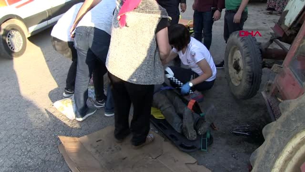 Tamir etmek istediği traktörün altında kaldı