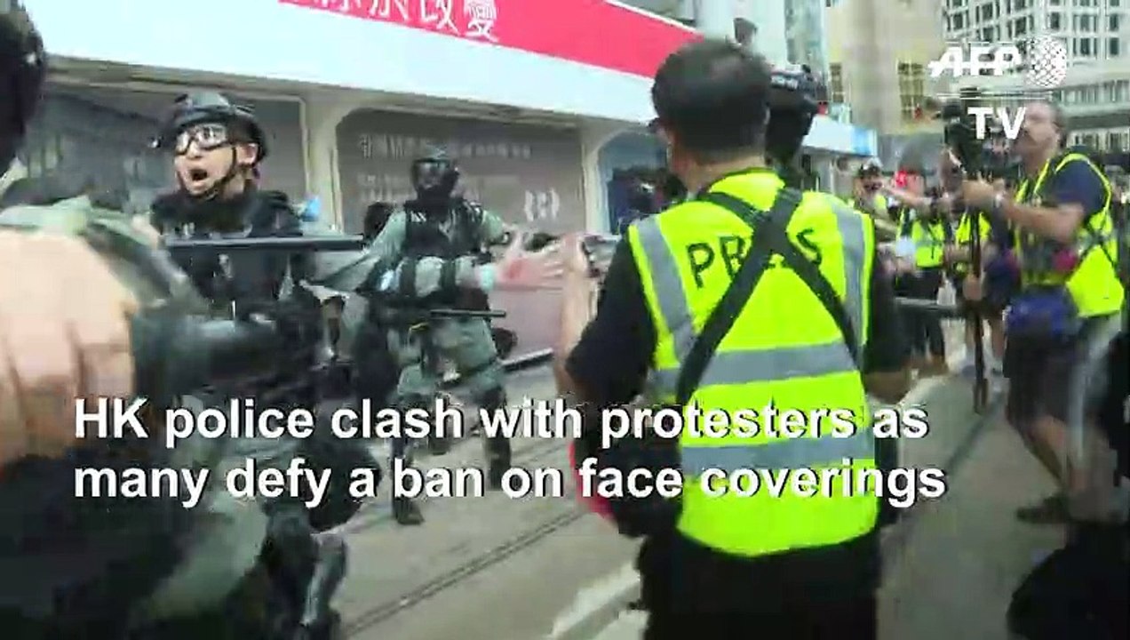Hong Kong police arrest masked man after protesters defy mask ban