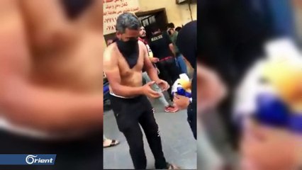 امرأة عراقية تعيد زمن الماجدات العربيات وتشعل ثورة بمشاهد توزيعها مناديل على المصابين والمتظاهرين