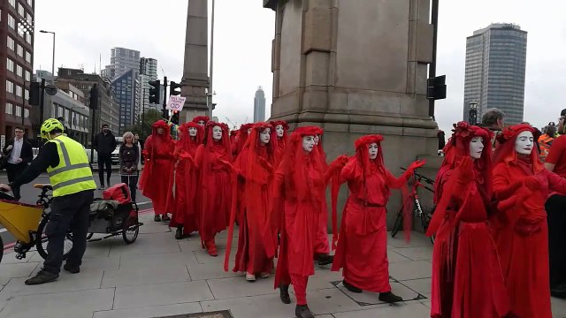 Lambeth Bridge closed as Extinction Rebellion protesters dressed in red robes patrol London