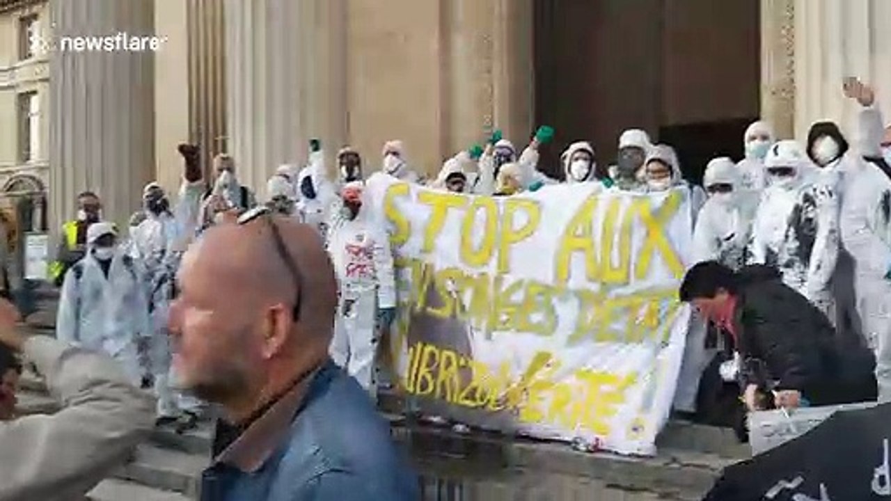 French activists drop 'contaminated' water vials to protest American chemical plant following fire