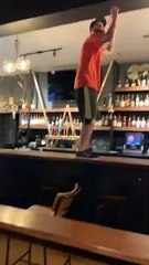 Manager Attempts to Remove Sticky Bra from Ceiling