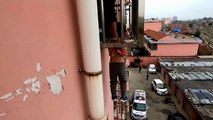 Firefighters rescue boy danging from fourth-floor window in China