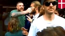 Hungry 'burger man' shoves protestors aside so he can feed