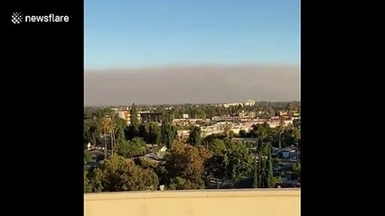 Southern California sees wall of smoke from brush fires that claimed one life and many homes