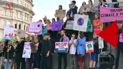 Climate Change Protestor Dances on the Roof of London City Airport