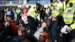 Extinction Rebellion protesters arrested as roof invader removed by police at London City Airport