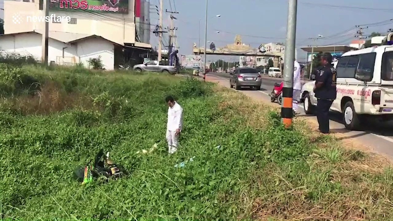 Ghost rider! Motorbike rolls for 400-metres after driver was knocked off in Thailand