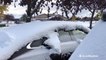 Cars buried in snow after winterlike storm in autumn