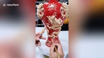 Chinese man shows off incredible handicraft skills while decorating vases