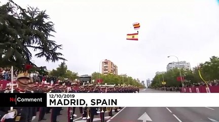 Parachutist left dangling during Spain's National Day parade