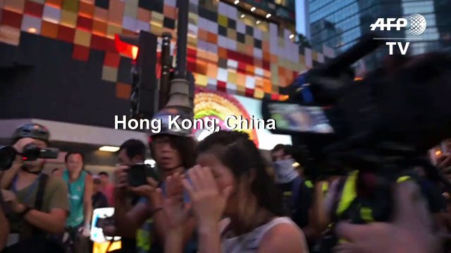 Hong Kong police make arrests as 'flashmob' protests hit pro-Bejing targets