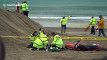 Marshal seriously injured as motocross bike lands on him during practice race on Weymouth beach, UK