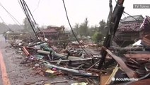 Typhoon's powerful winds rip homes to shreds