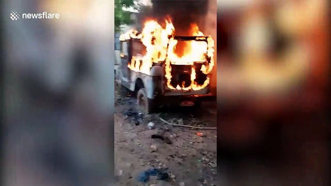 Locals crawl under burning car to rescue trapped puppies in west India