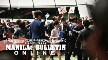 Hong Kong leader abandons policy speech after heckling from lawmakers