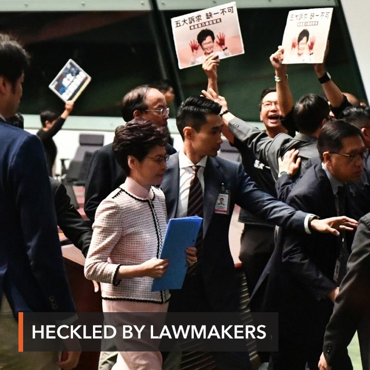 Hong Kong leader abandons policy speech after heckles from lawmakers
