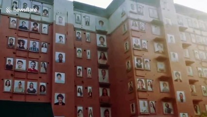 Eerie sight of abandoned building with hundreds of smiling portraits