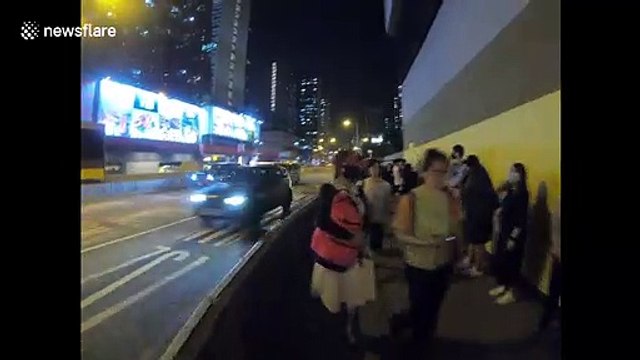 Hong Kong activists form human chain in protest of face mask ban