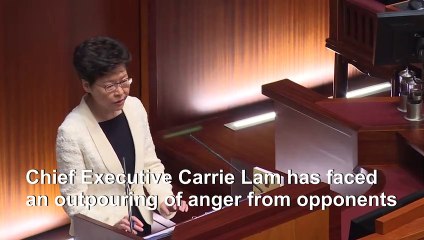 Hong Kong lawmakers dragged from chamber as leader heckled for second day