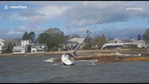 Sailboat blown ashore by bomb cyclone in US Northeast