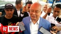 Cops question Najib over Facebook post