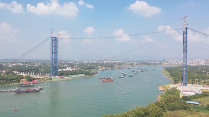 Assembly of world's longest arch bridge gets underway in southern China