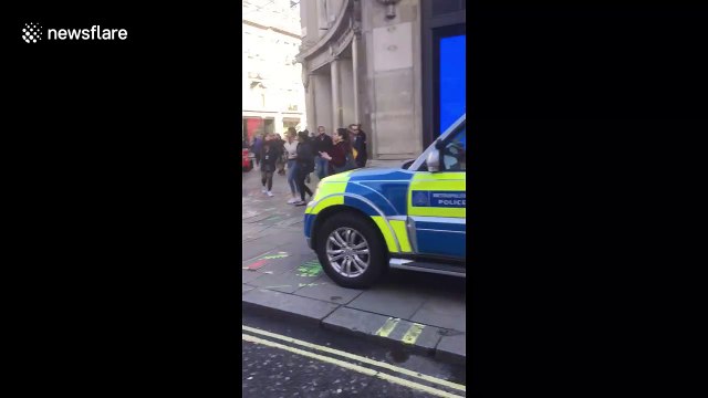Extinction Rebellion protesters block off Oxford Circus using massive wooden structures