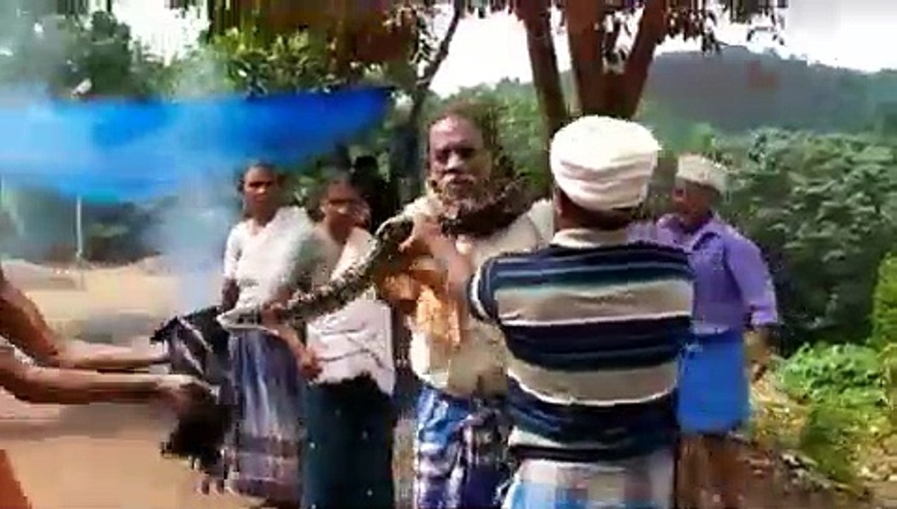 Python creates scare, coils itself around man's neck