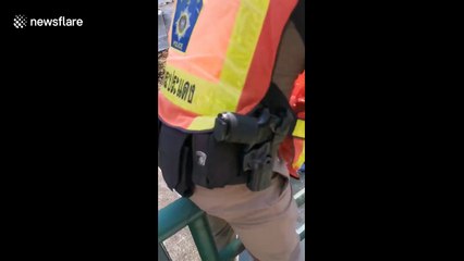 Passersby leap into filthy canal to save unconscious man from drowning in Thailand