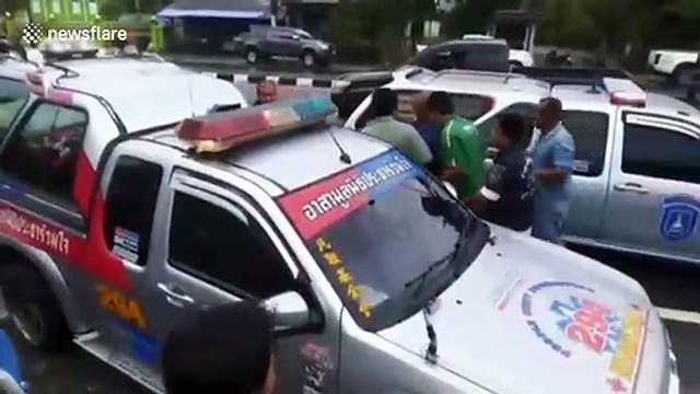 Pickup truck loses control on wet road and smashes into electricity pole