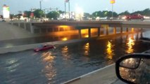 Car Takes on Flooded Underpass in Reverse