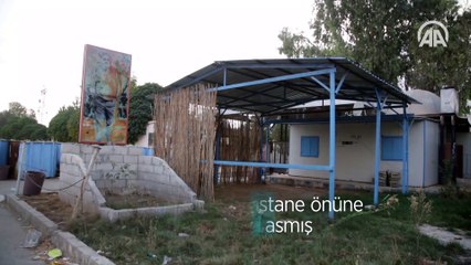 YPG/PKK tahrip ettiği hastane önüne teröristbaşı posteri asmış