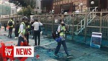 Jets of blue dye, water fired at Kowloon Mosque