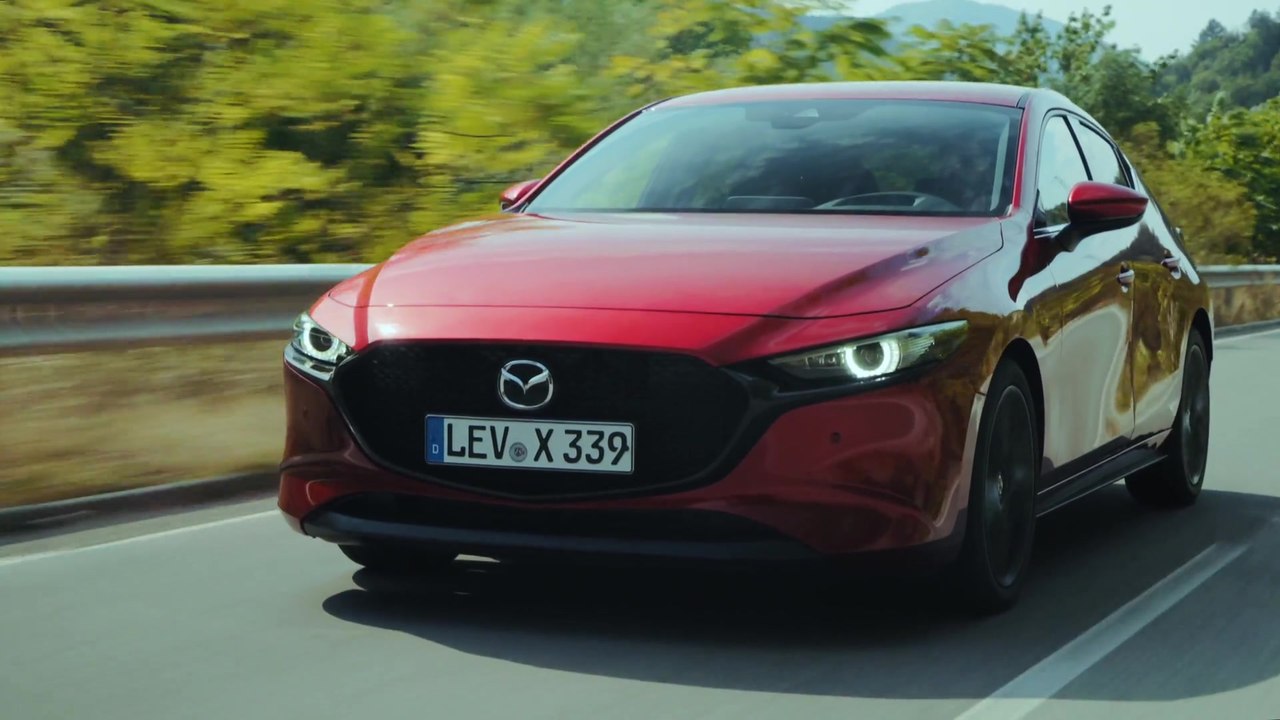 All-New Mazda3 Skyactiv-X Hatchback in Soul Red Crystal Driving in Bulgaria