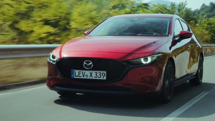 All-New Mazda3 Skyactiv-X Hatchback in Soul Red Crystal Driving in Bulgaria