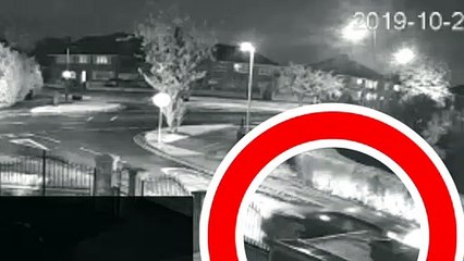 CCTV footage of car driving with open boot and person inside