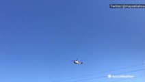 Helicopters fly over burning Palisades fire