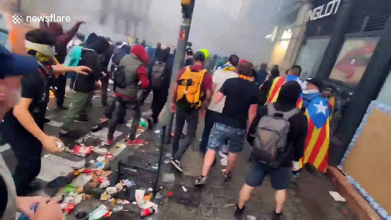 Catalan independence rally turns violent as protestors ignite barricades