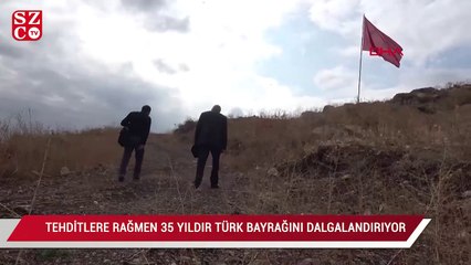 Tehditlere rağmen 35 yıldır Türk bayrağını dalgalandırıyor