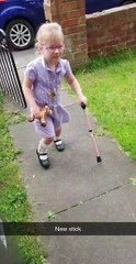 Brave Dottie walks with a single walking stick for the first time.