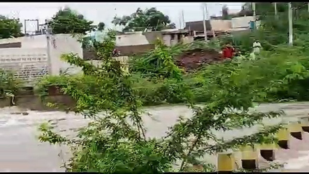 Terrifying moment biker is washed away by flood in India