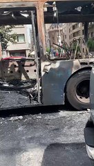 Musician Performs in Burned Out Bus