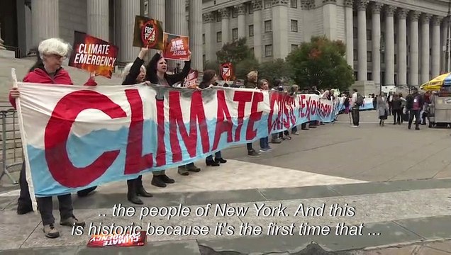 Climate activists protest outside court as Exxon Mobil goes on trial