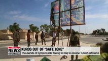 Thousands of Syrian Kurds fleeing to Iraq to escape Turkish offensive