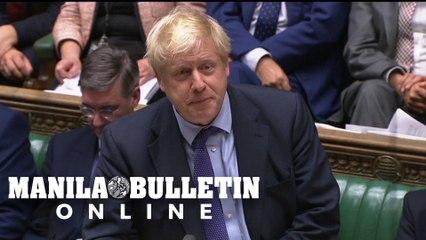 British PM pauses Brexit bill after losing timetable vote