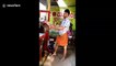 Indian tea seller showcases his extreme height pouring skills without spilling a drop