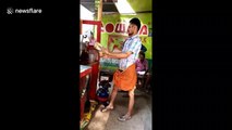 Indian tea seller showcases his extreme height pouring skills without spilling a drop