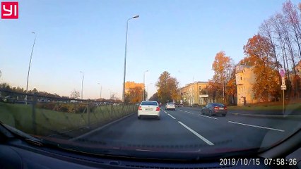 Tight Squeeze Sends Sedan on its Side