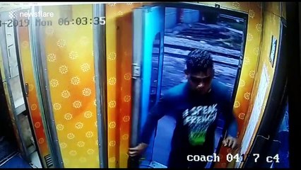 Moment thief climbs onto MOVING train in India to rob passenger - before hopping off